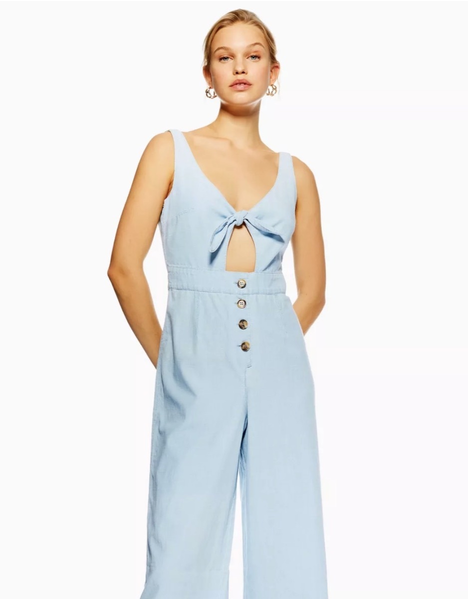 woman wearing denim jumpsuit with tie front, end of summer sales 2019