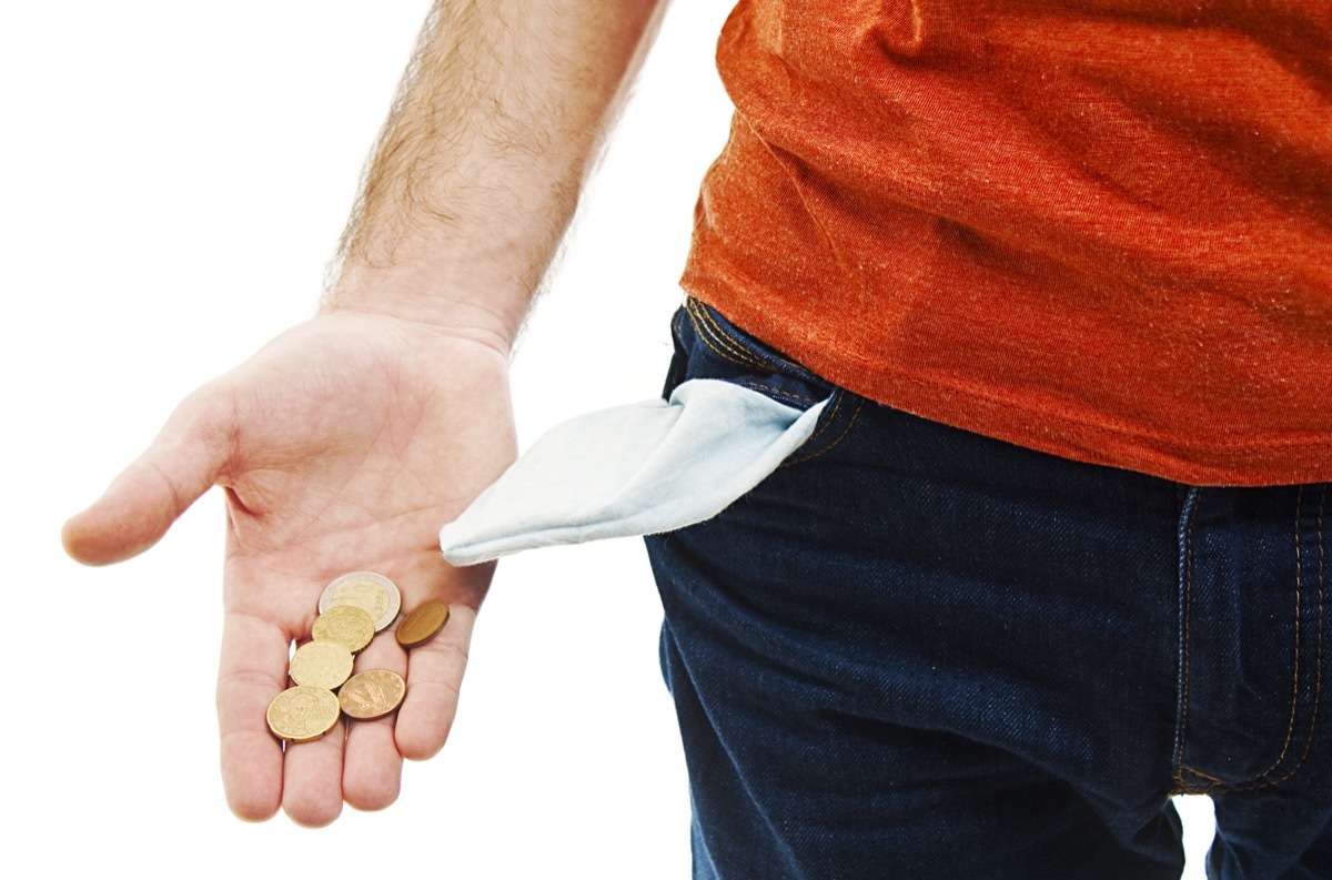 Man pulling change coins out of his pocket