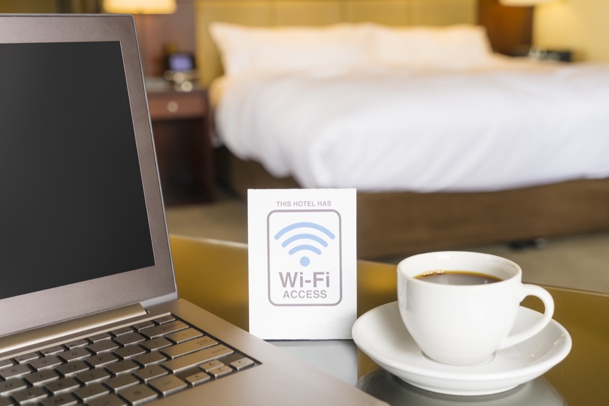 hotel wifi access with laptop and cup of coffee on table