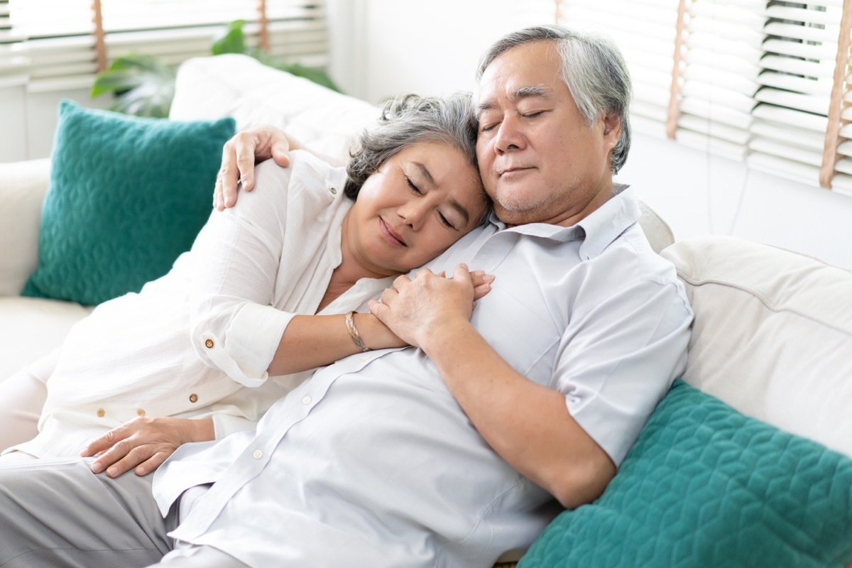 Older couple cuddling smitten