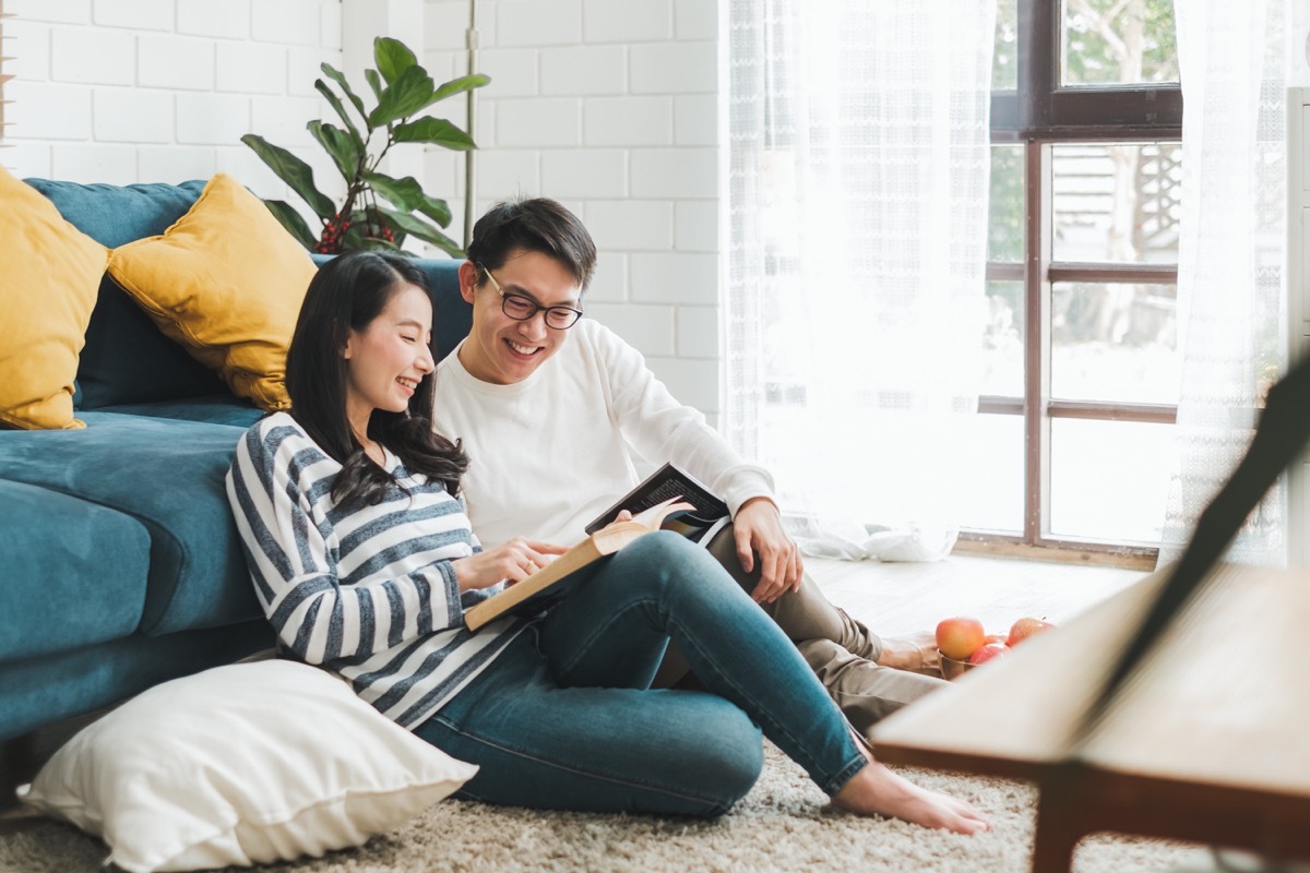 Intelligent couple reading together