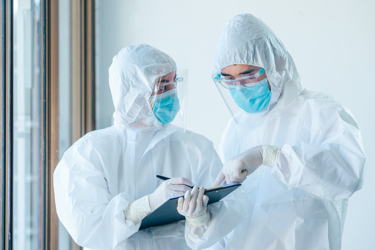 Two doctors wearing personal personal protective equipment 