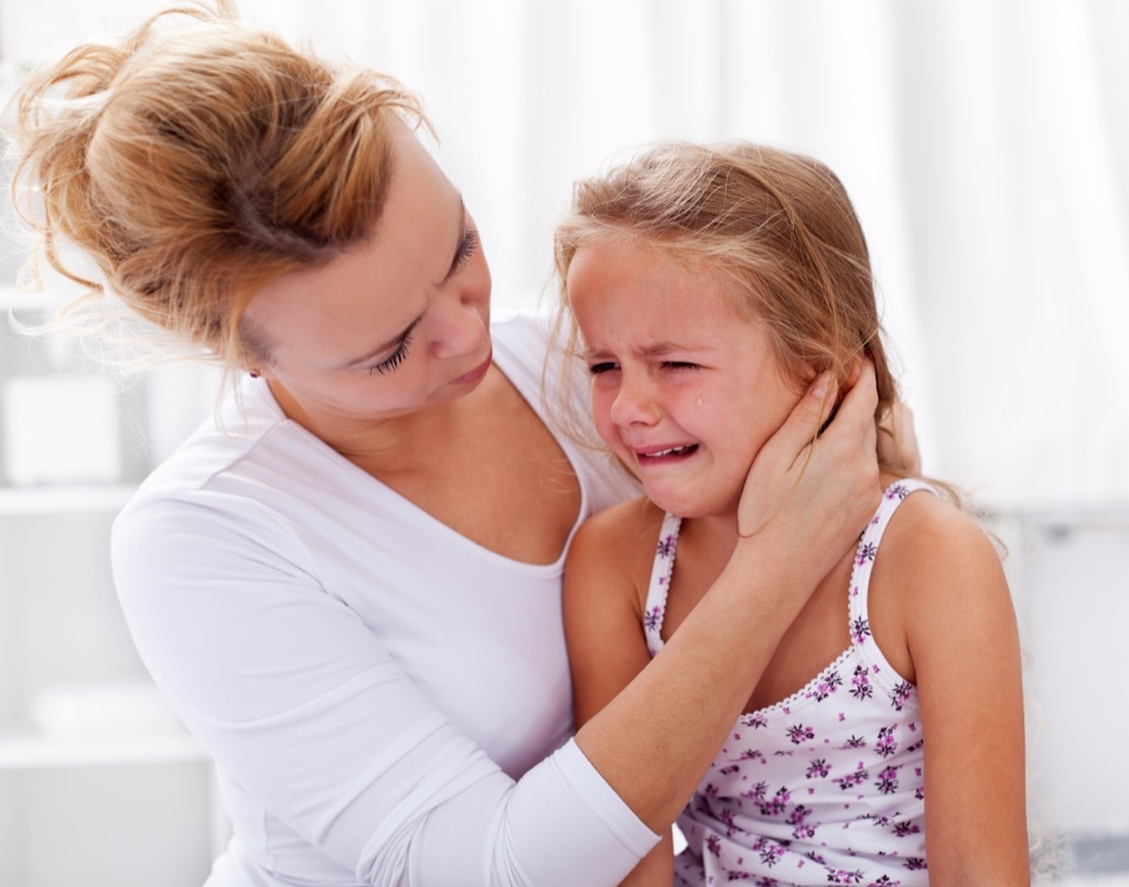 mom comforting crying child