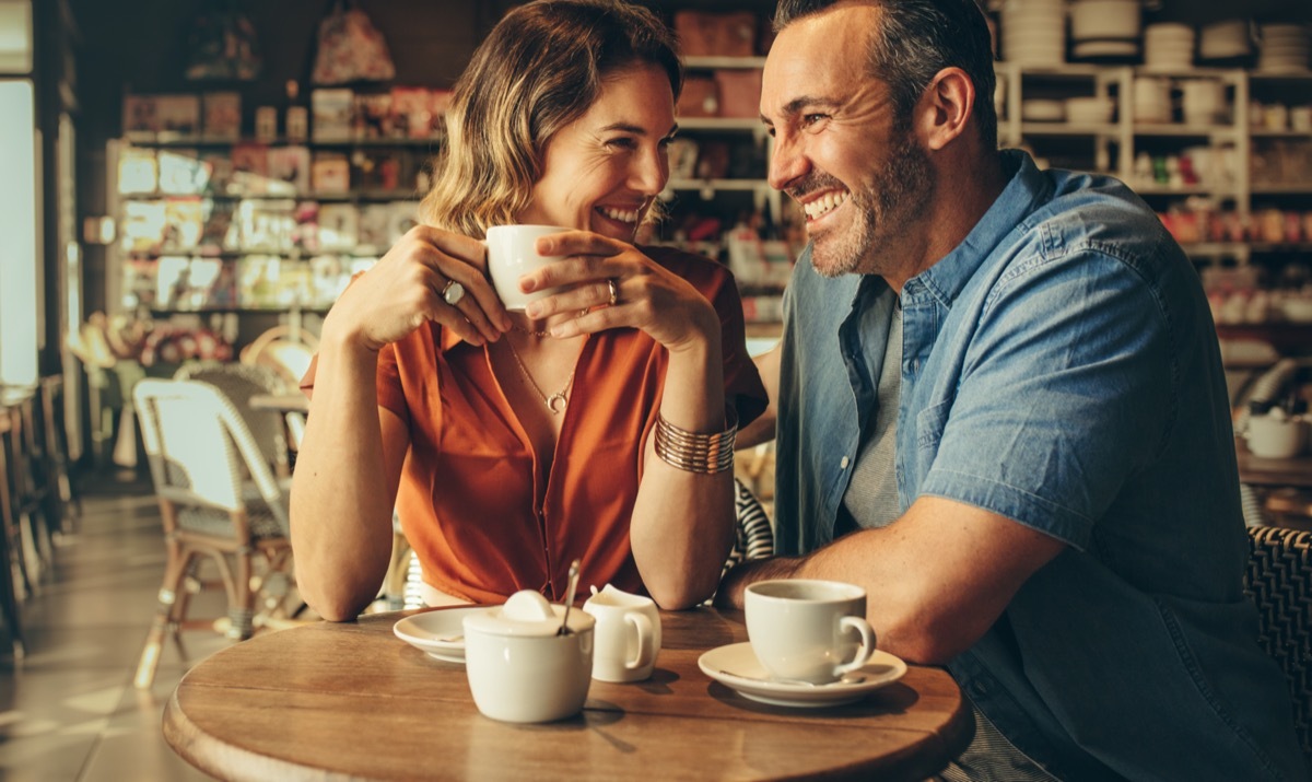 Man and woman sitting close in coffeeshop