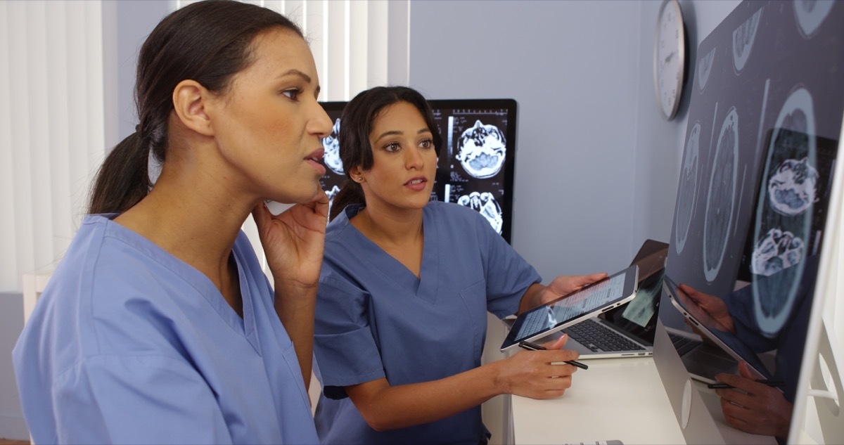 Black and hispanic female doctors working together