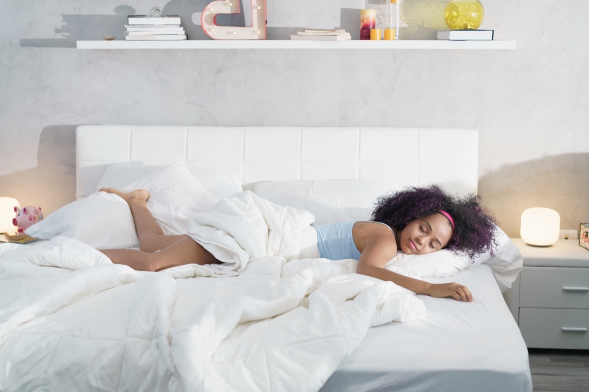 Woman taking up the whole bed sleeping alone