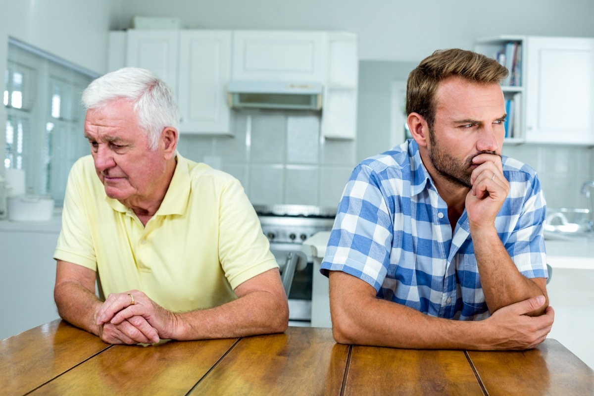 upset white father and adult son