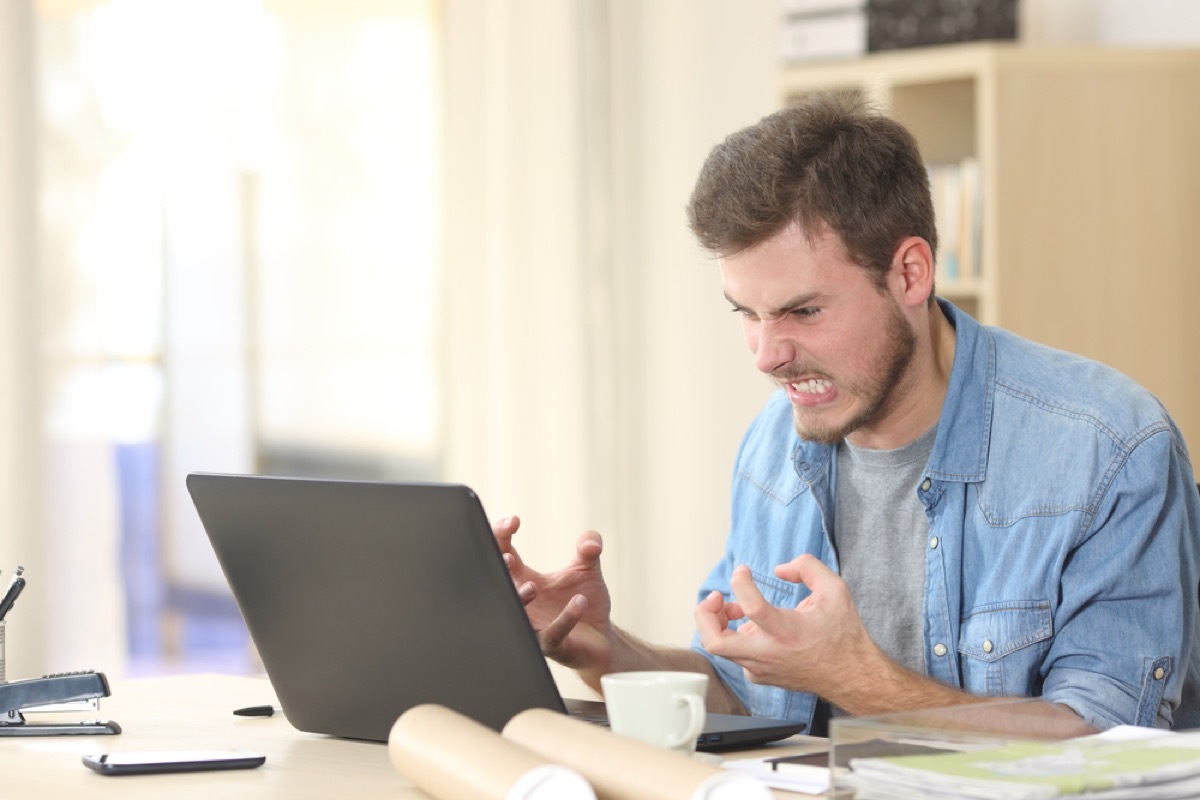 angry white man yelling at laptop