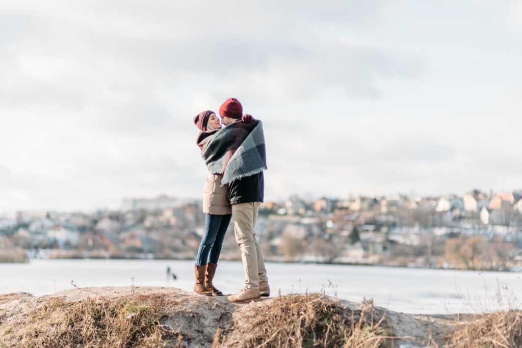 couple embracing hugging on some rocks