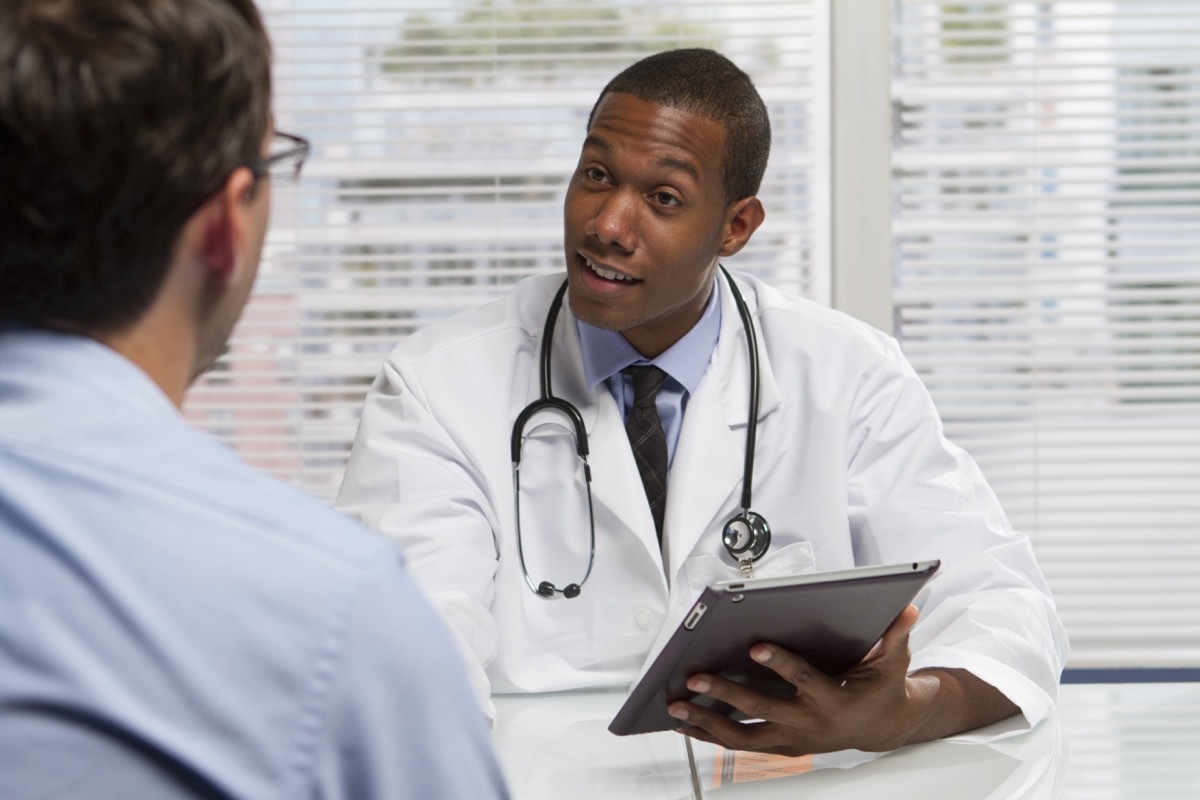 doctor consulting with patient, horizontal