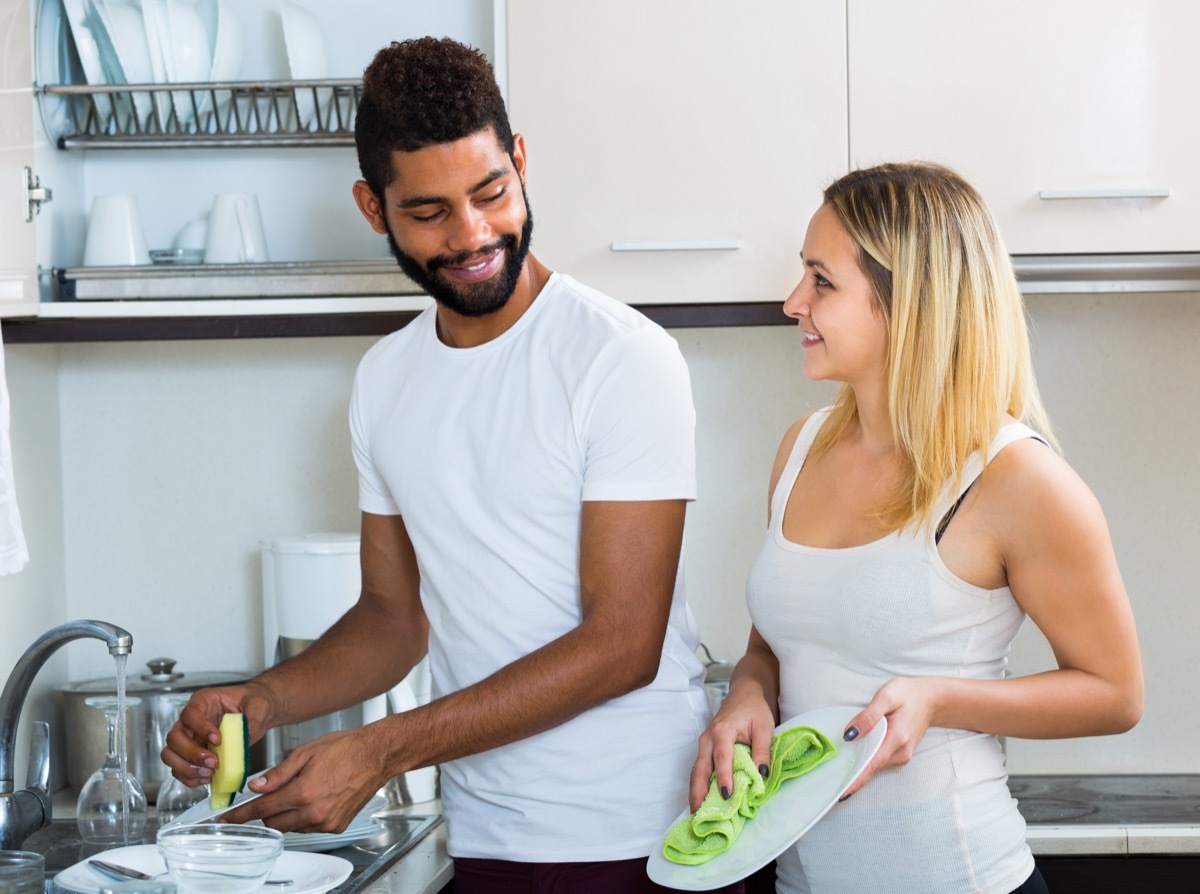 Two People Cleaning Dishes at the Sink BBQ Etiquette Mistakes