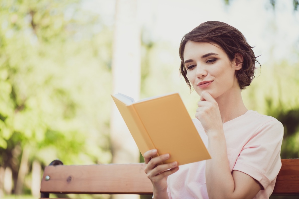 Woman Reading a Book in Nature