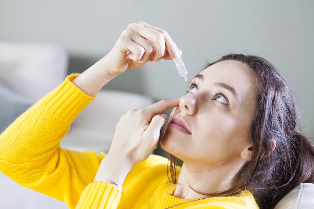 Young woman uses eye drops for eye treatment. Redness, Dry Eyes, Allergy and Eye Itching