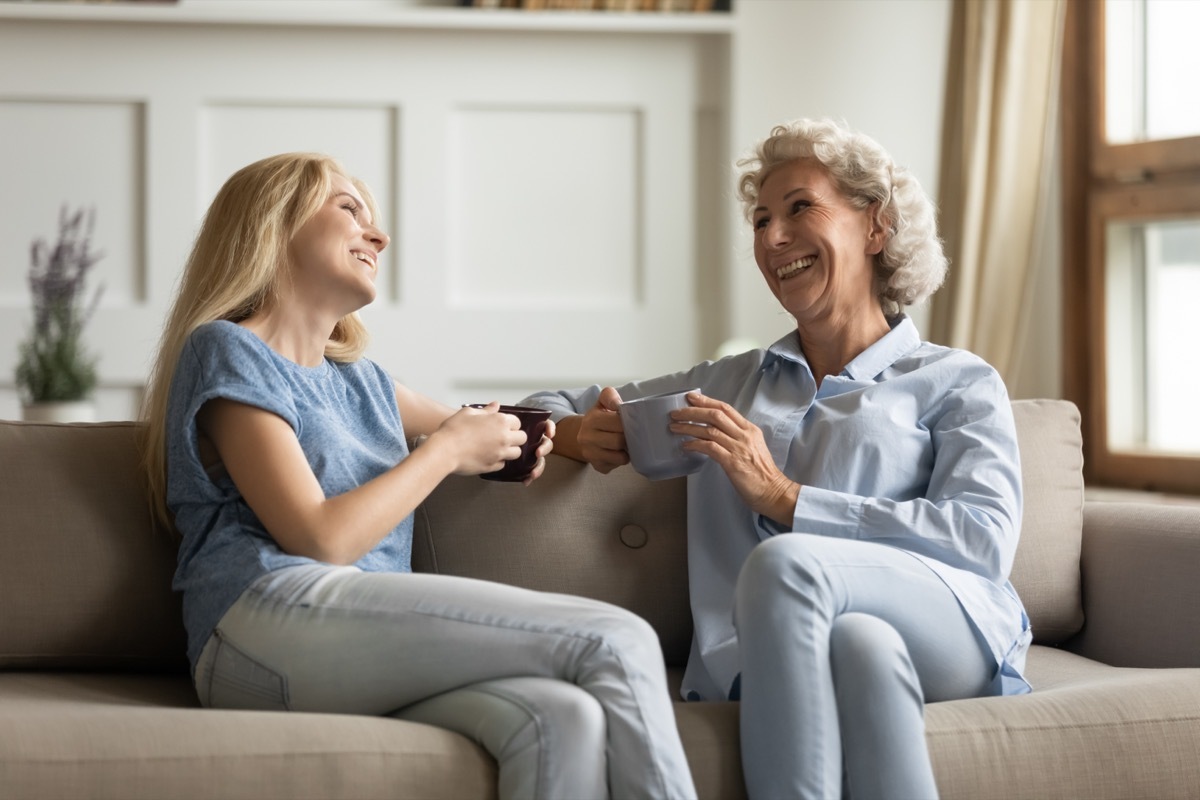 Older Woman and Younger Woman Chatting Over Coffee