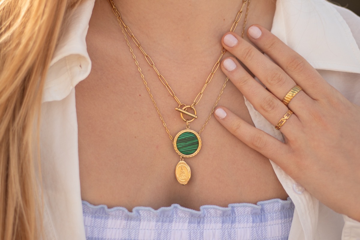 wearing layered gold jewelry