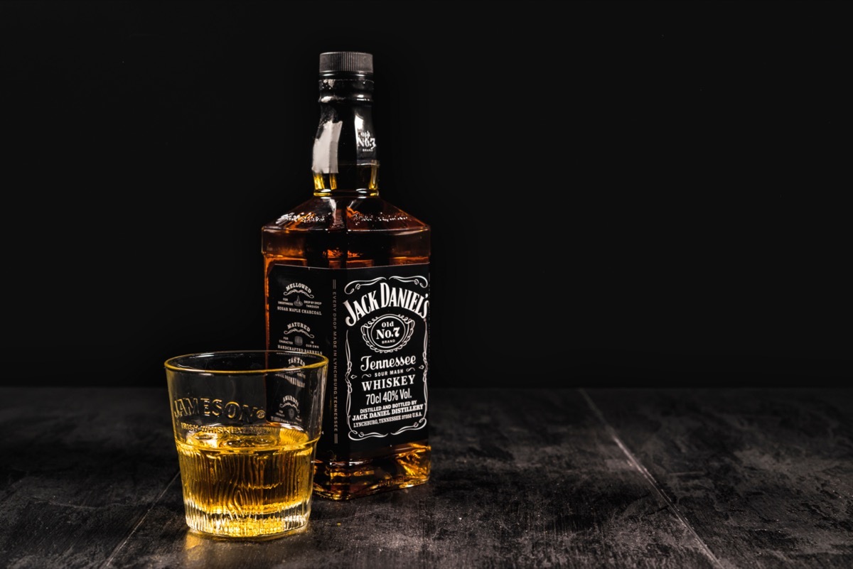 Jack Daniel's bottle and glass on a table