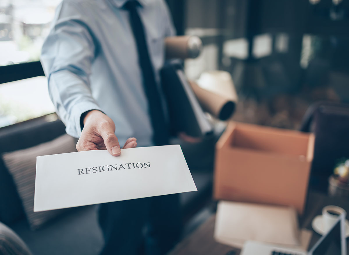 Man turning in his resignation letter