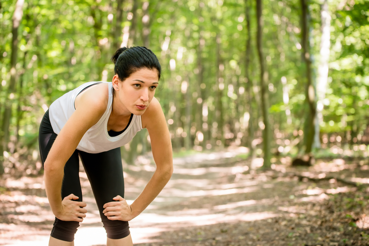 Tired female runner outside