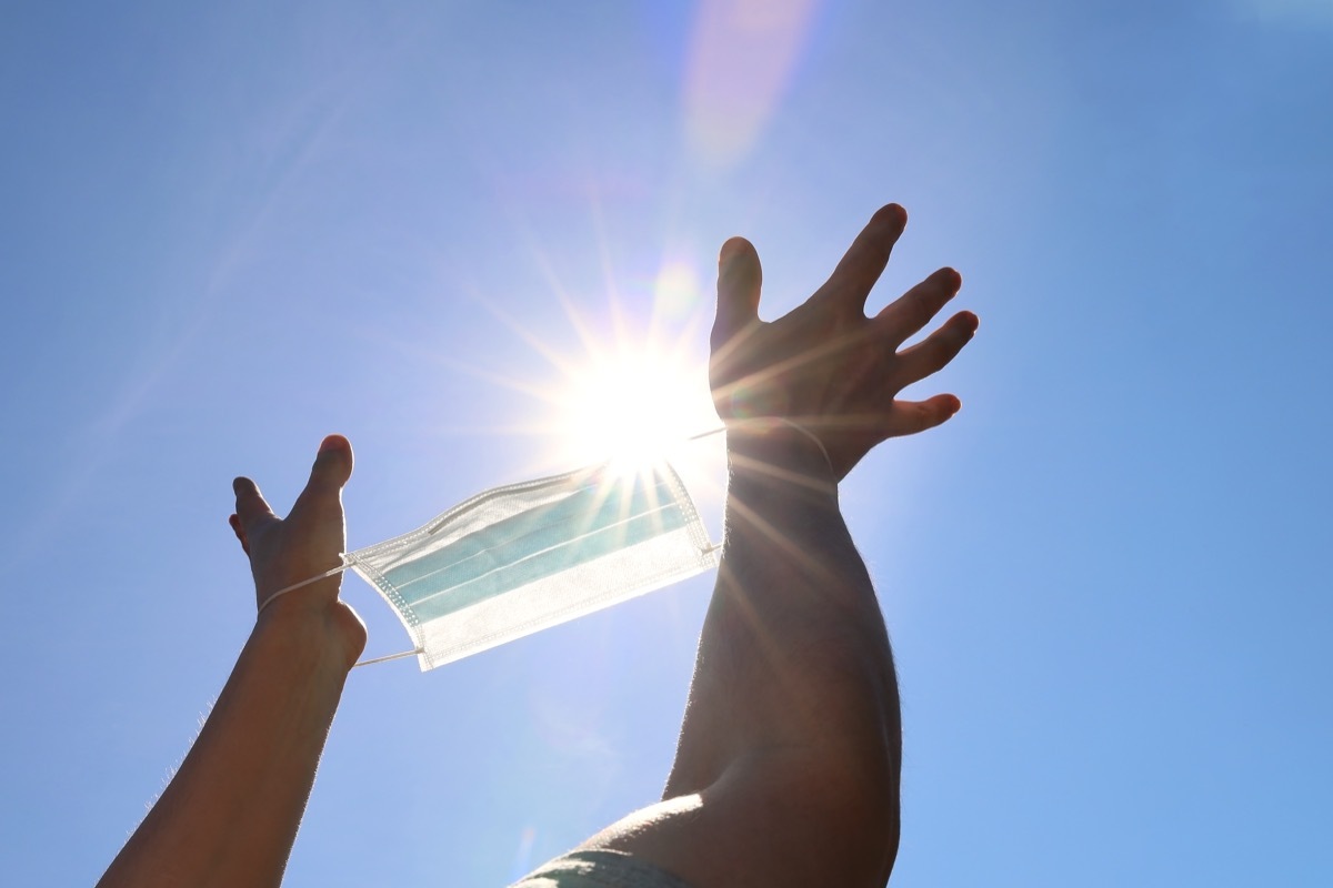 Holding mask to sunlight