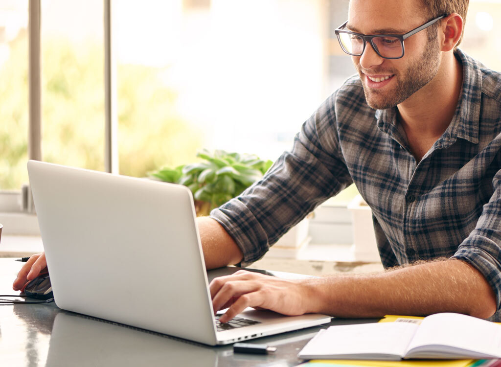 Happy man at computer