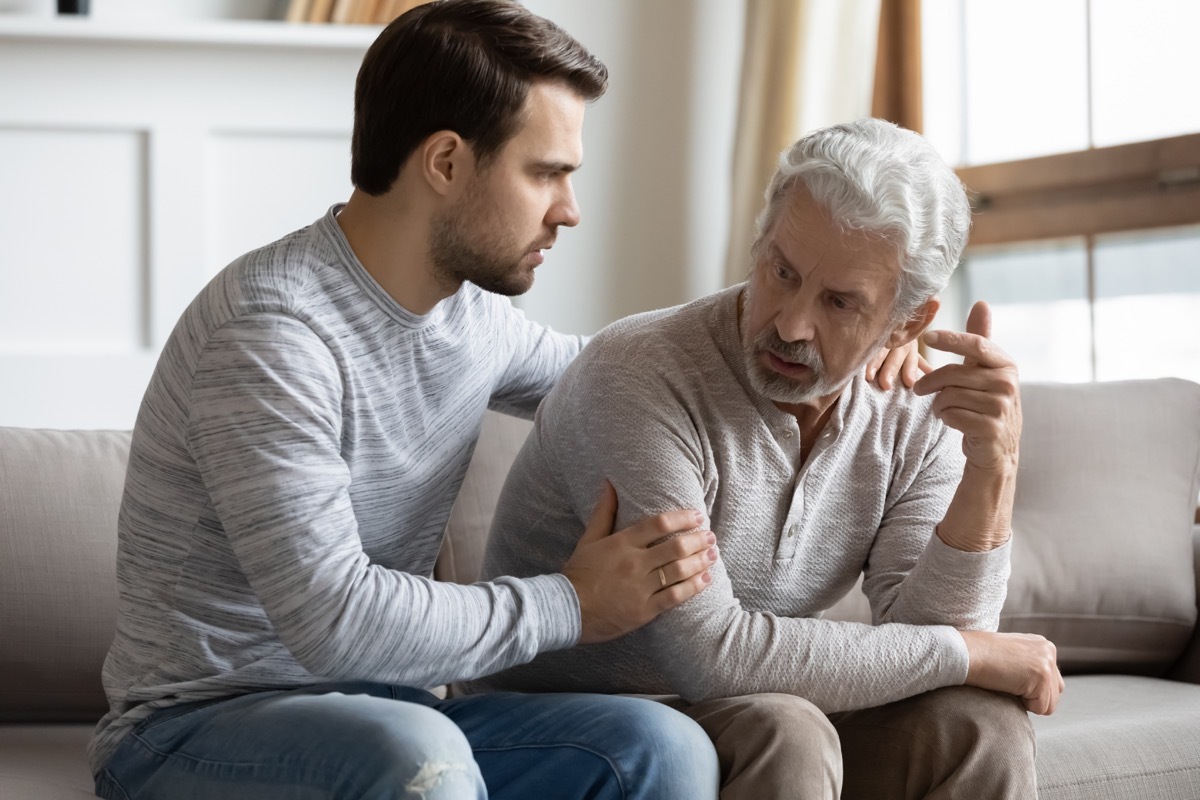 Man comforting agitated father