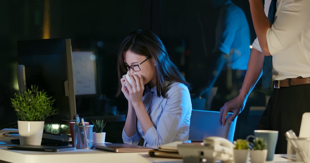 businesswoman is sick and cough while working