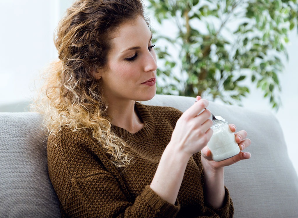 Woman eating yogurt