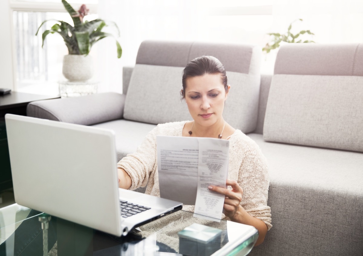 Woman in her 30s filling out tax information online