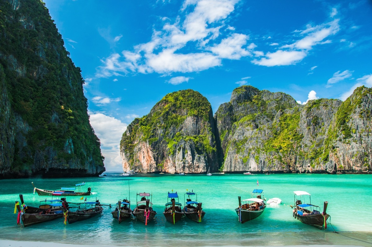 maya beach with canoe boats docked on the famous ko phi phi island