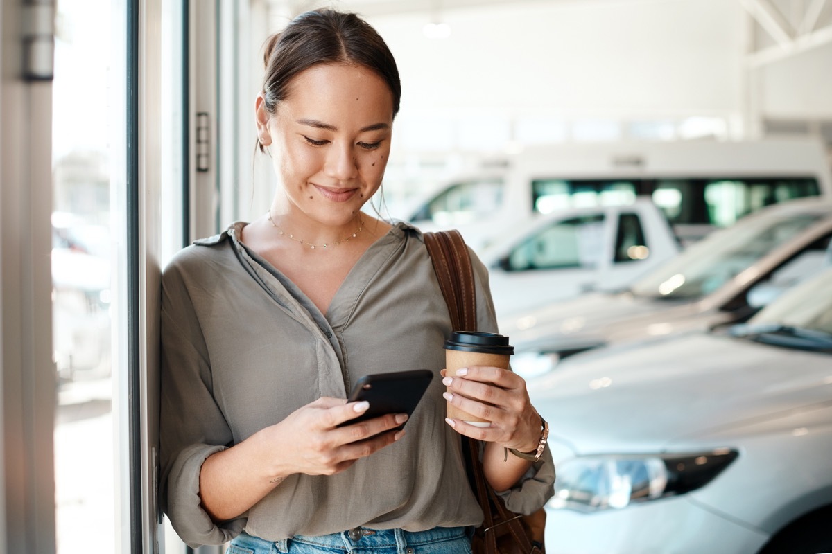 Shot of a young woman using her smartphone to send text messages