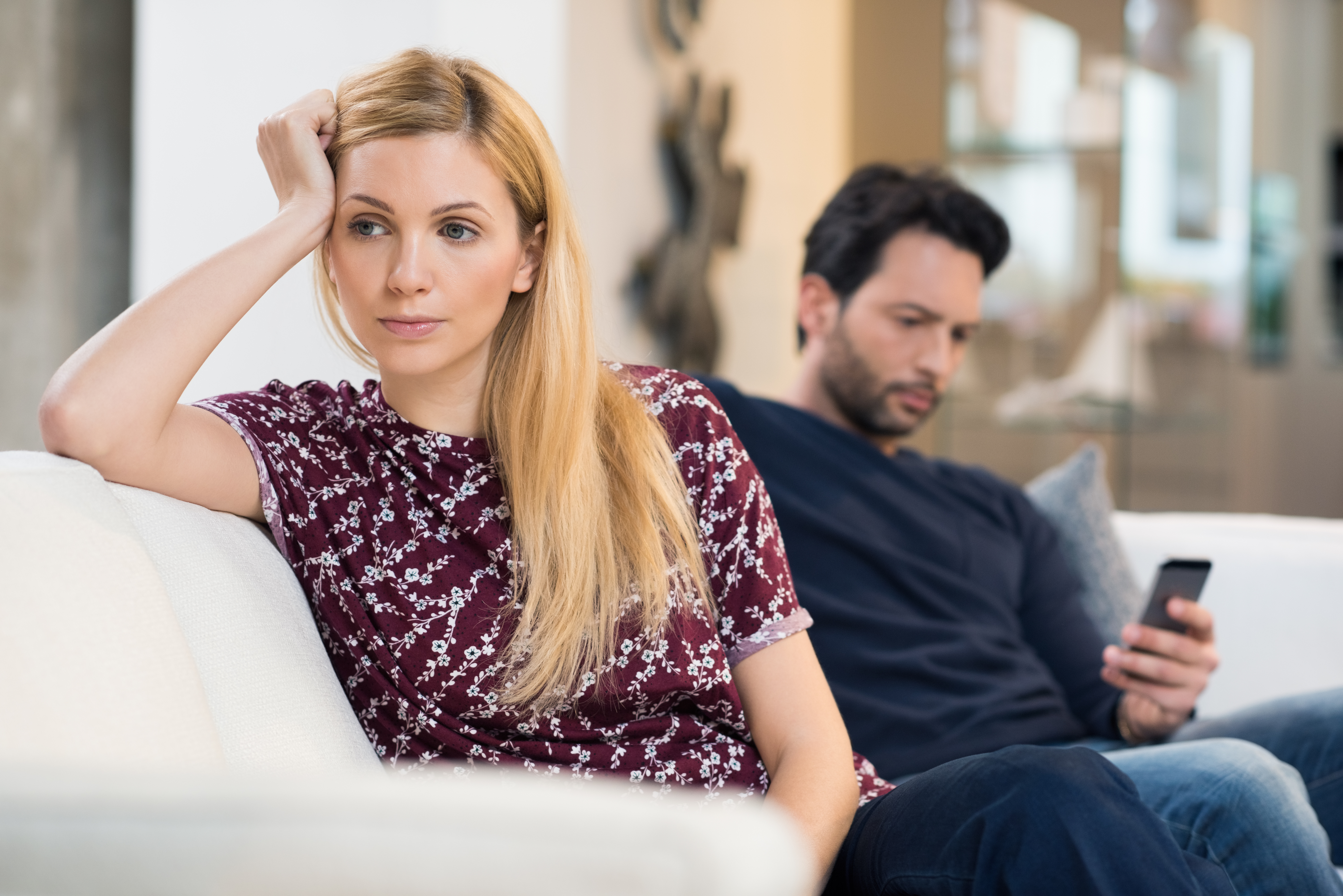 woman upset at husband on the couch, what he wants you to say