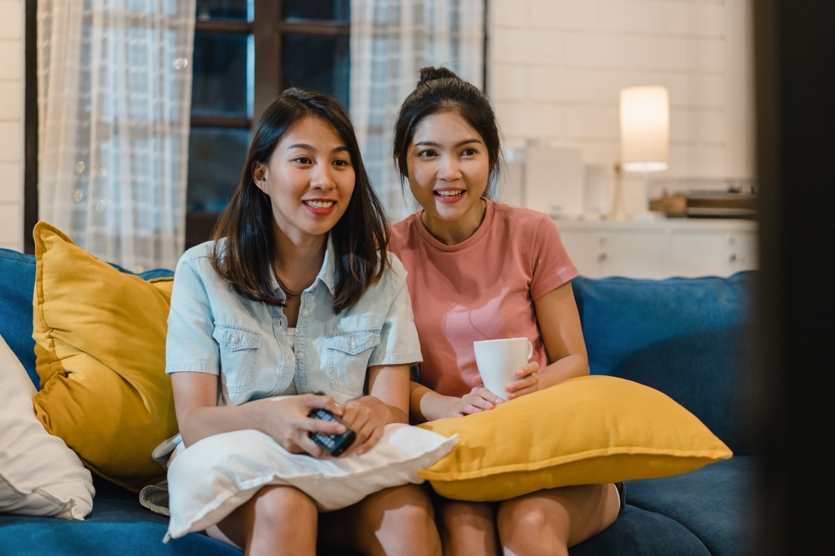 Girls watching movie on couch