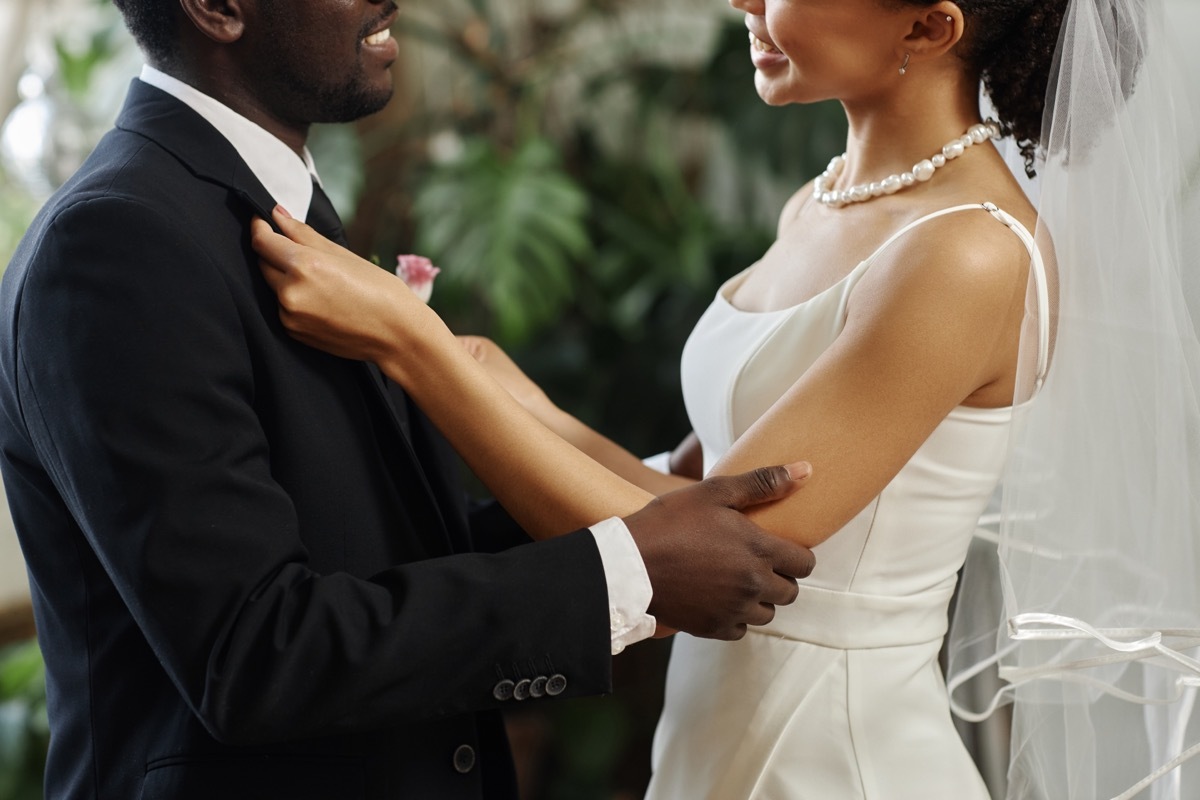 Side view of man and woman on their wedding day