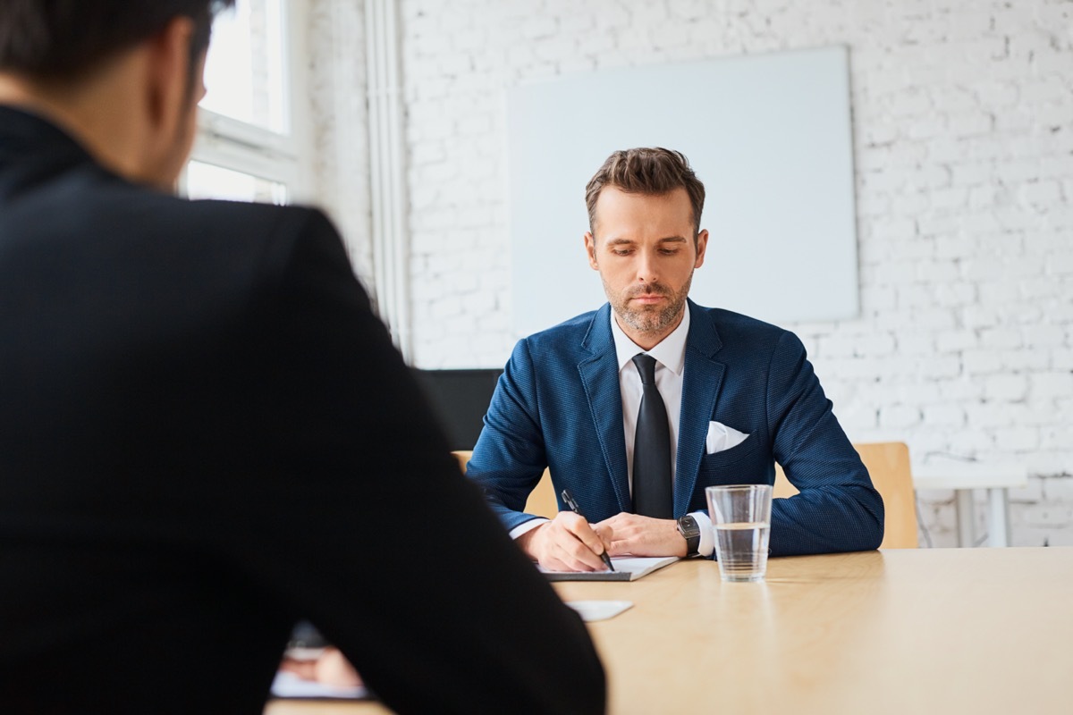 Two men meeting at conference room table