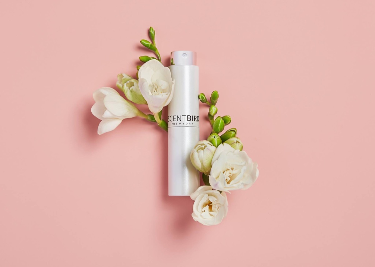 white scentbird bottle with flowers