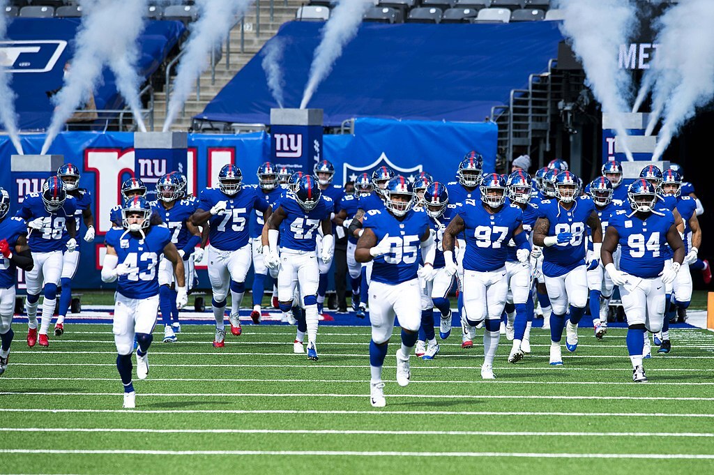 New York Giants football players running onto the field