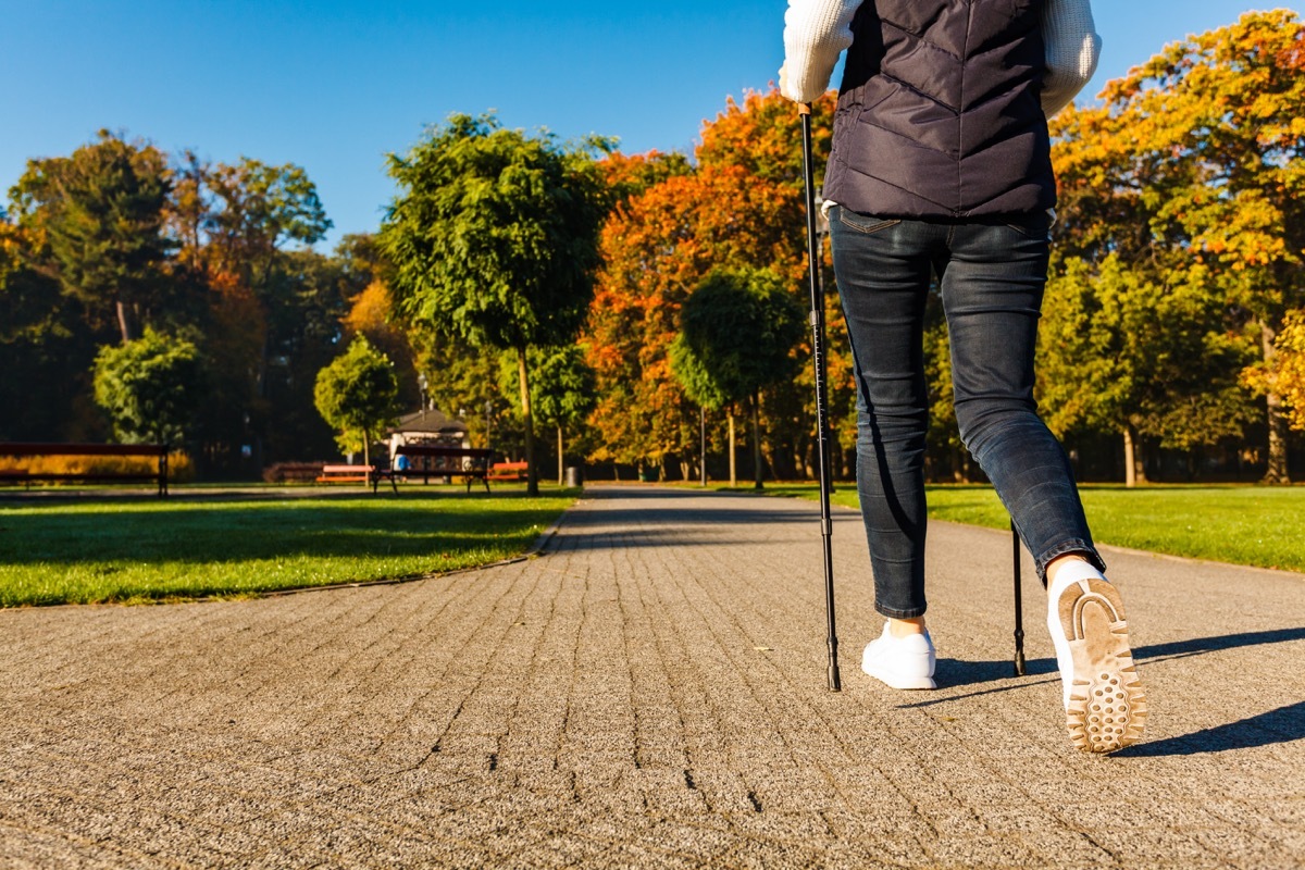 A woman power walking at the park