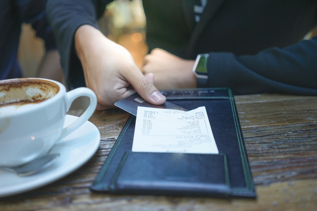 man paying his check at a restaurant