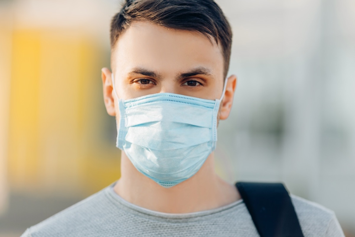 Man outside wearing medical mask