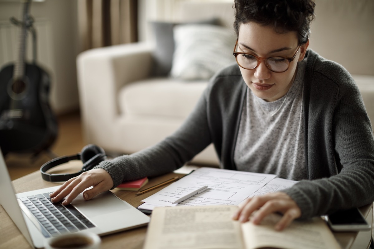 college girl studying and working on table