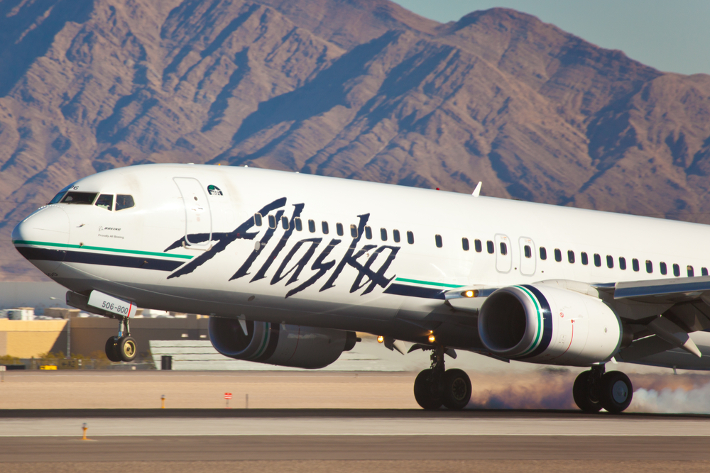 An Alaska Airlines plane landing at an airport