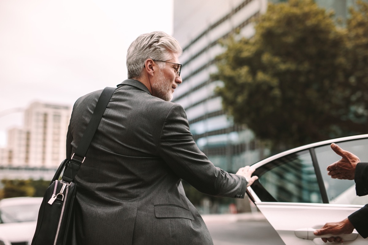 Older Man Using a Ridesharing App