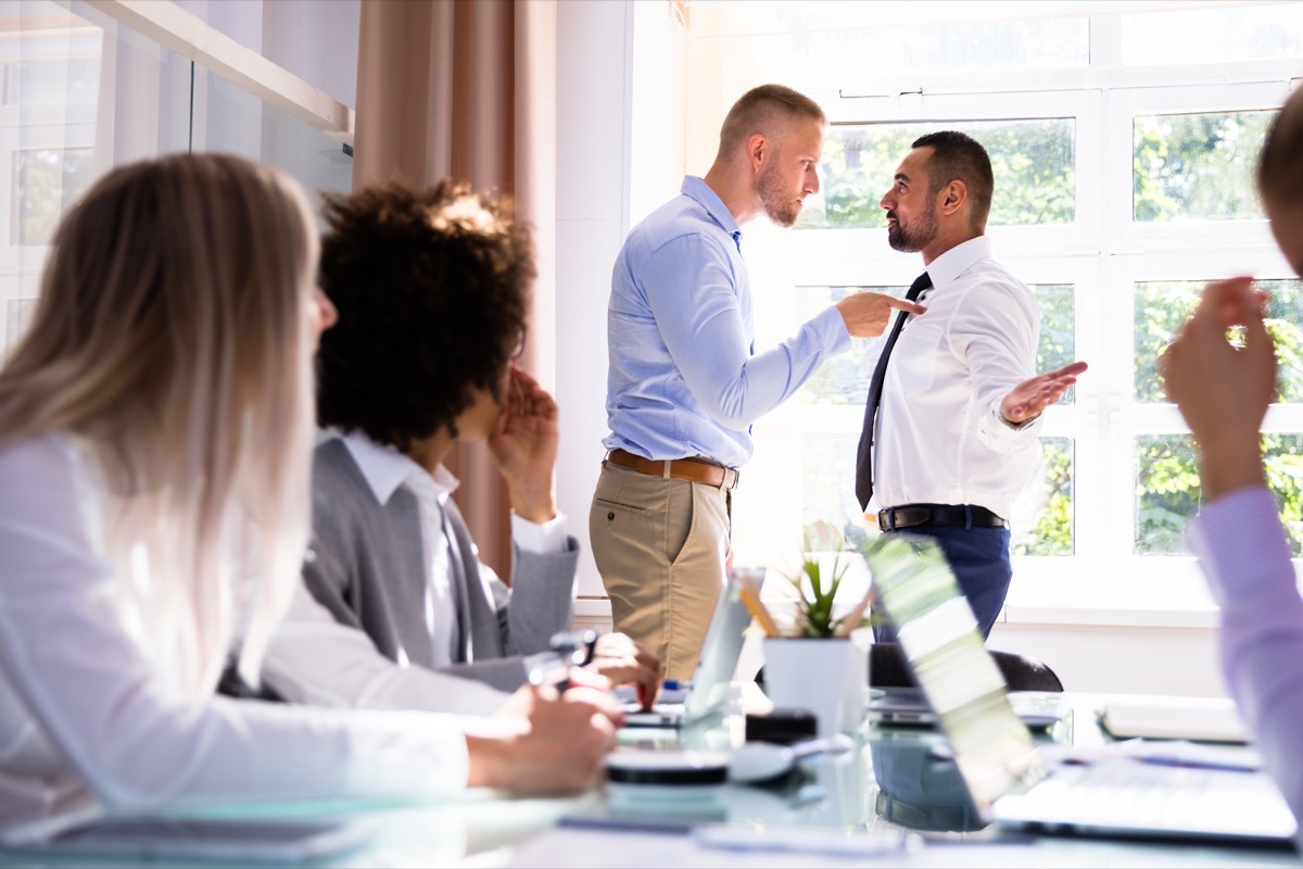 two male colleagues fighting