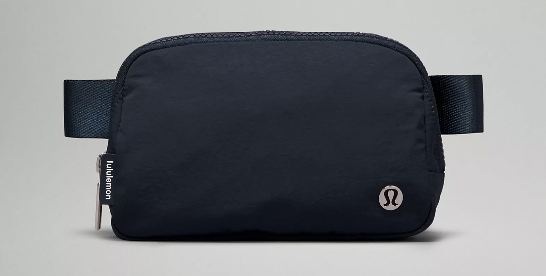 Navy blue Lululemon belt bag on gray background