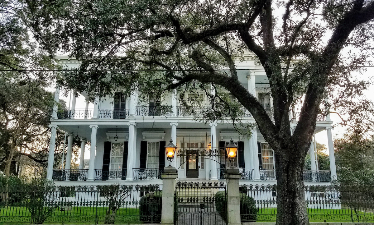 A grand white mansion in New Orleans' historic Garden District.