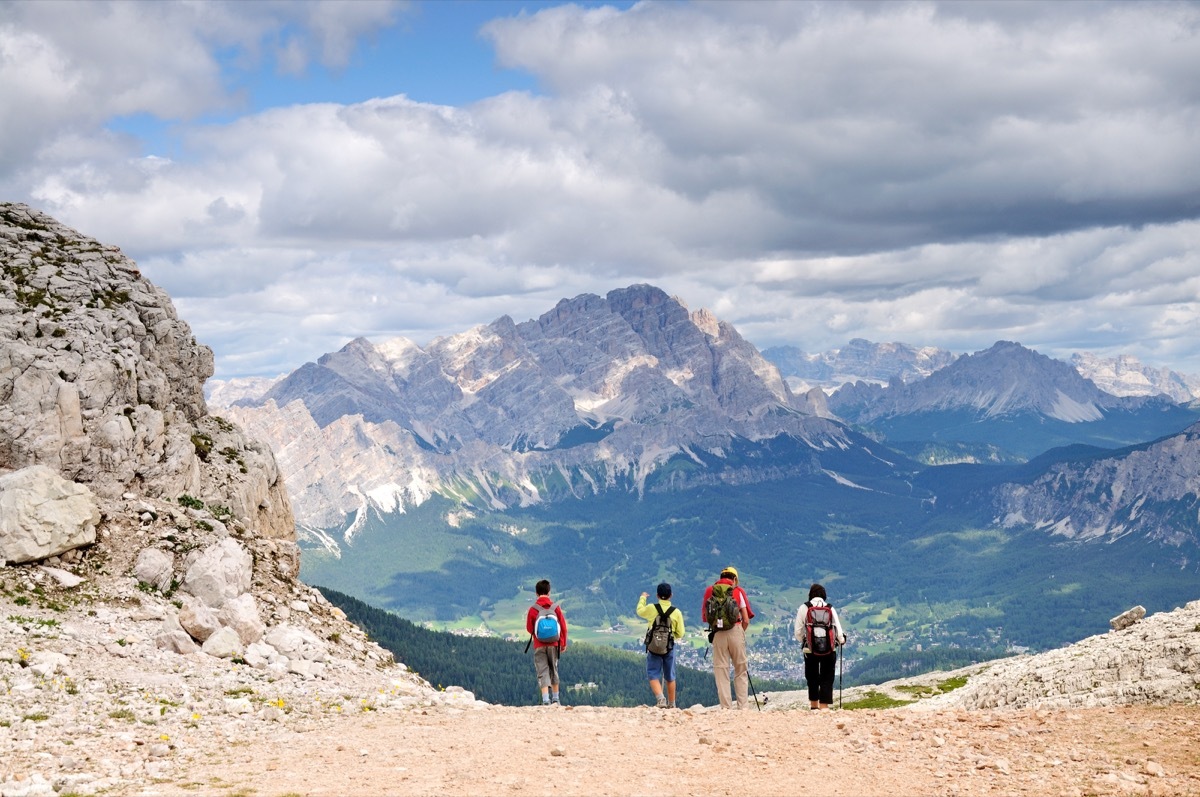 Family mountain climbing together