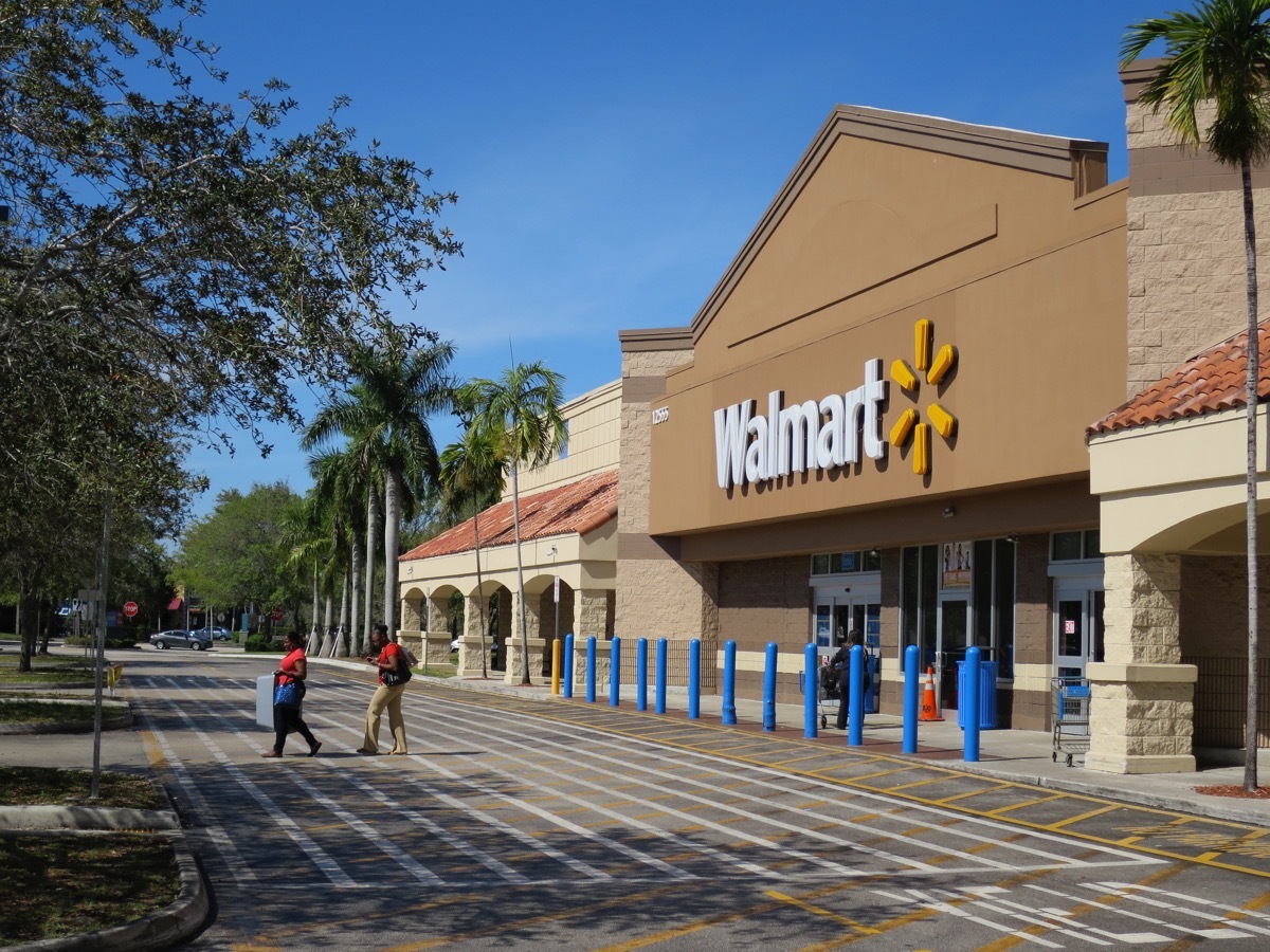 people coming out of a Walmart store on a sunny day