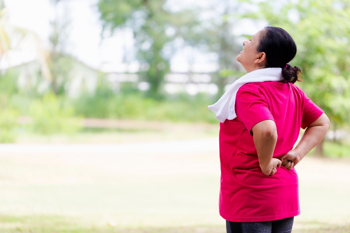 Woman stretching her back