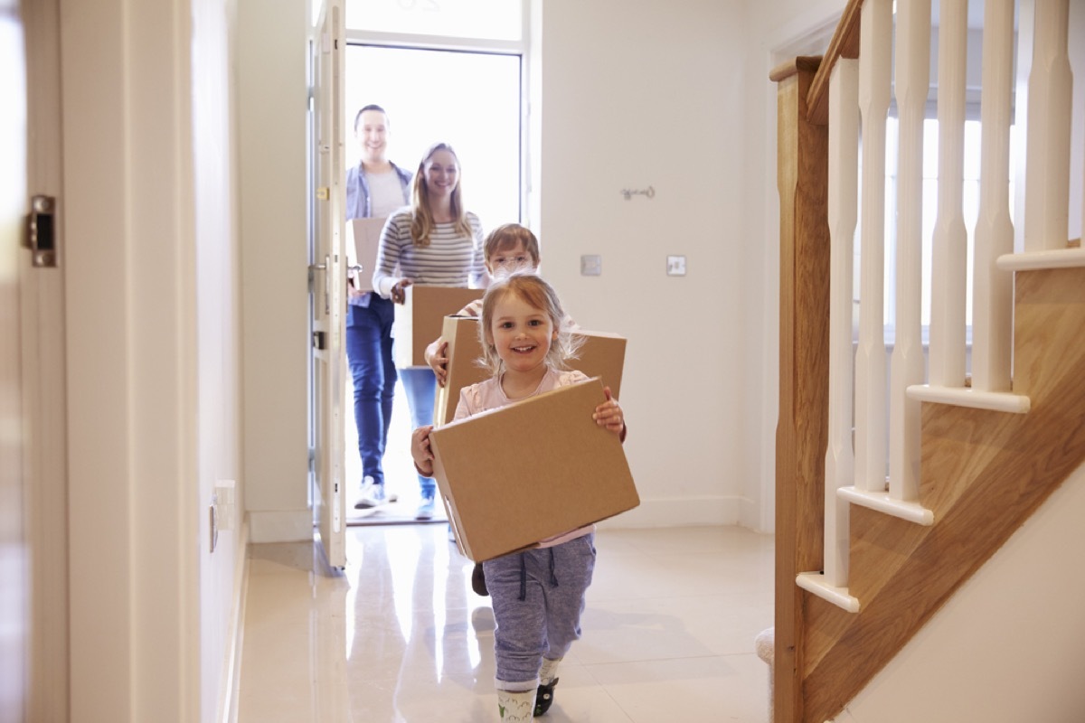 family carrying moving boxes, ways parenting has changed.