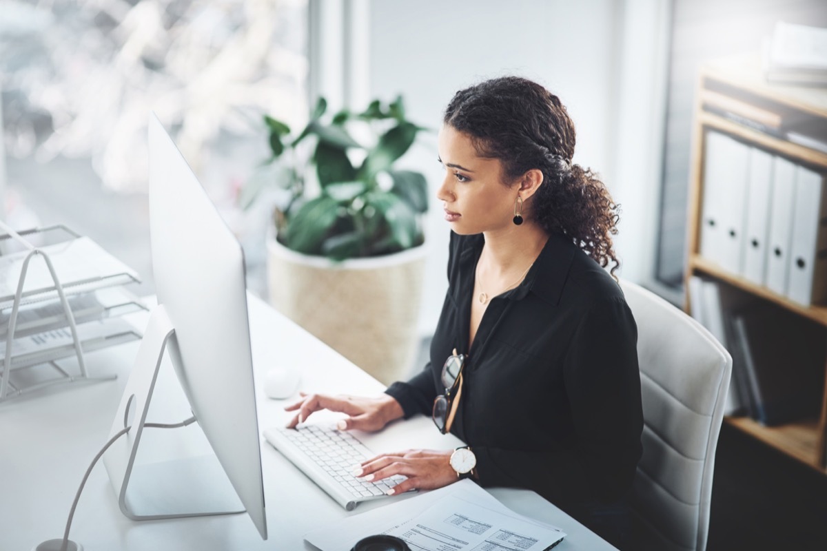 Shot of a young businesswoman working on a computer in an office